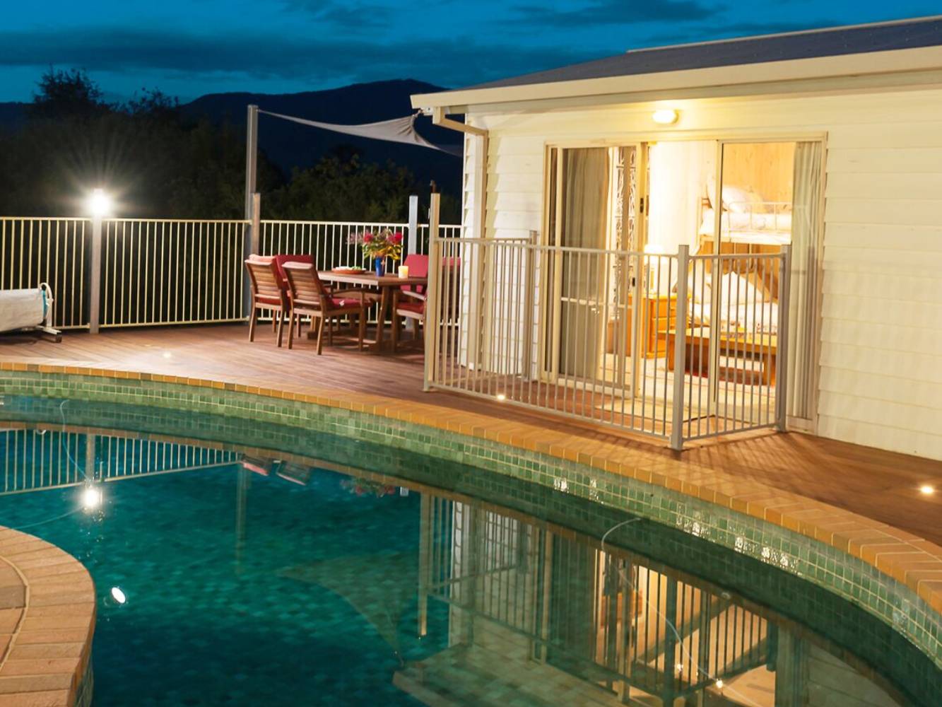 Night time view of Poolhouse