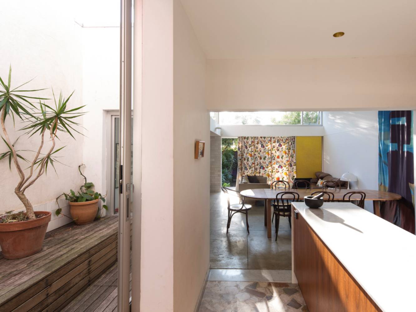 courtyard and kitchen thru to living and garden