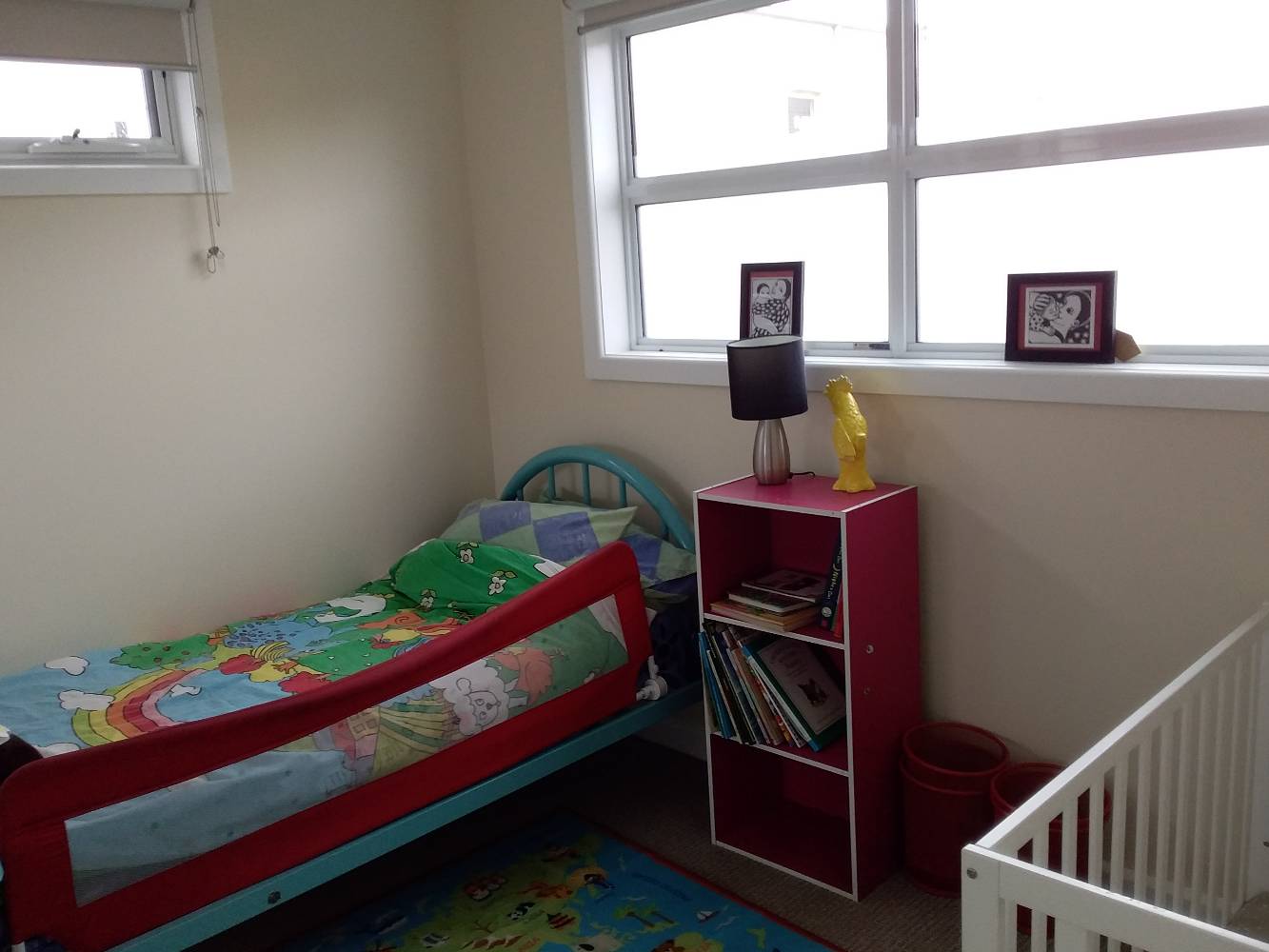 children's bedroom with cot and single bed