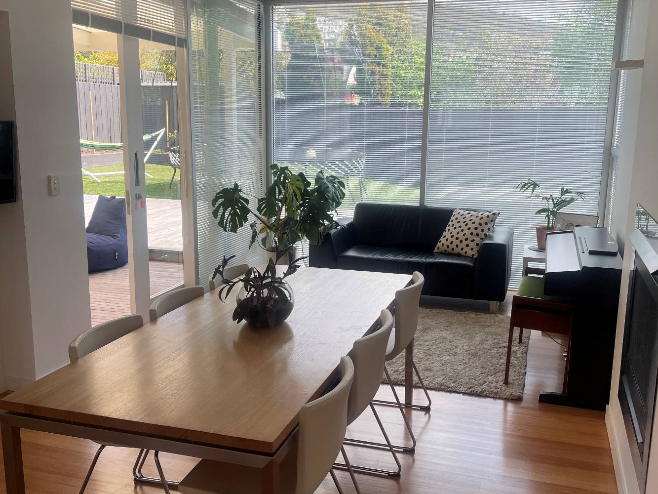 Dining and sitting area facing backyard