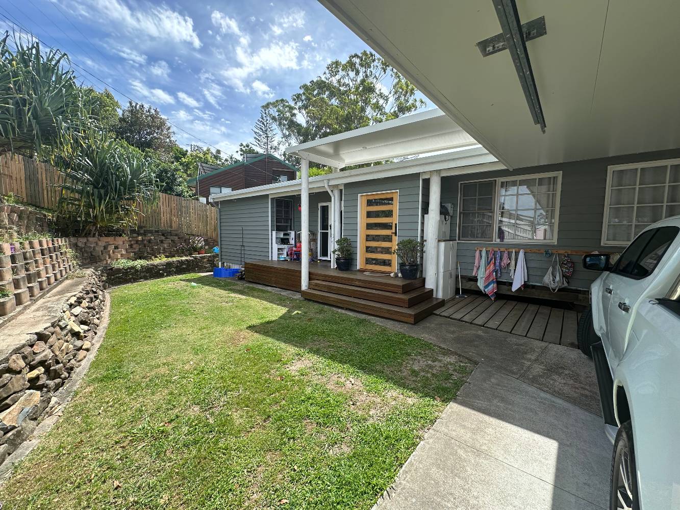 Front yard, and inside carport