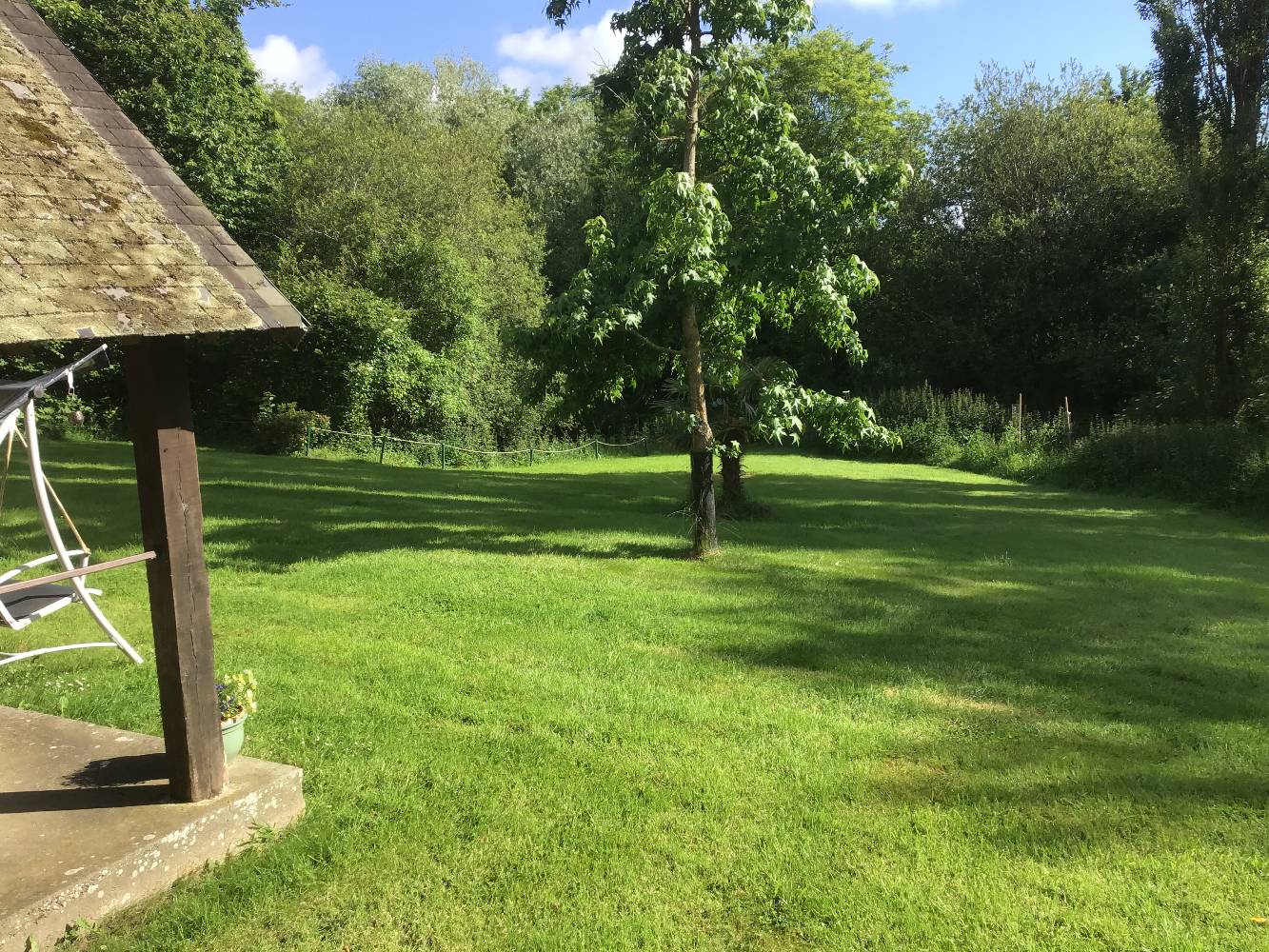 Half an acre garden leading to pond