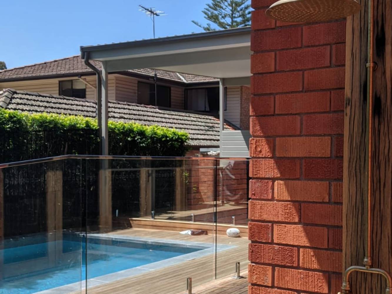 Outdoor shower next to pool