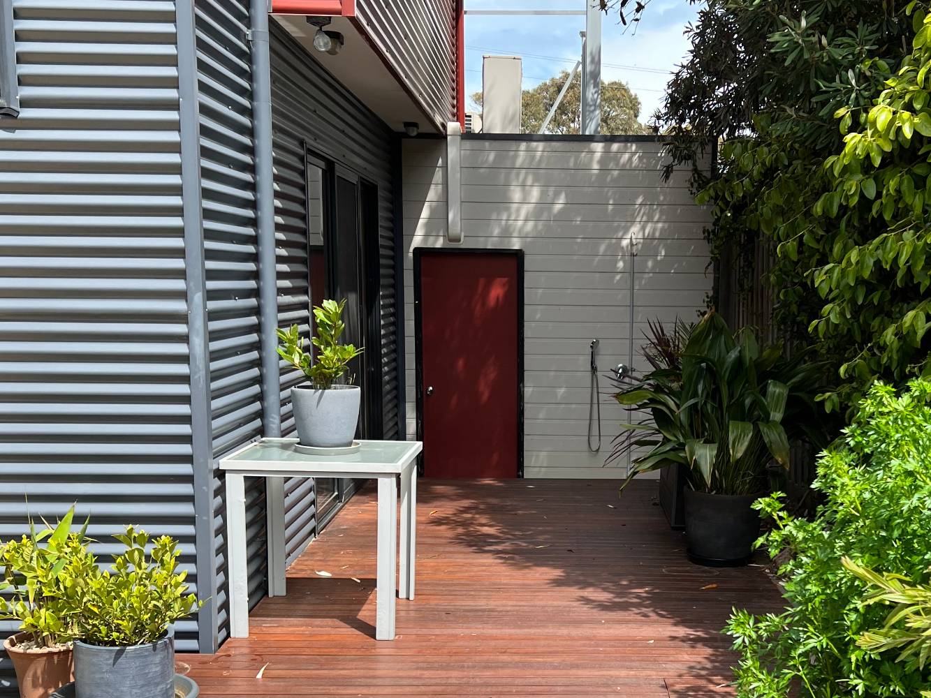 Backyard.  Door into lockup garage.  Sliding door from downstairs living area