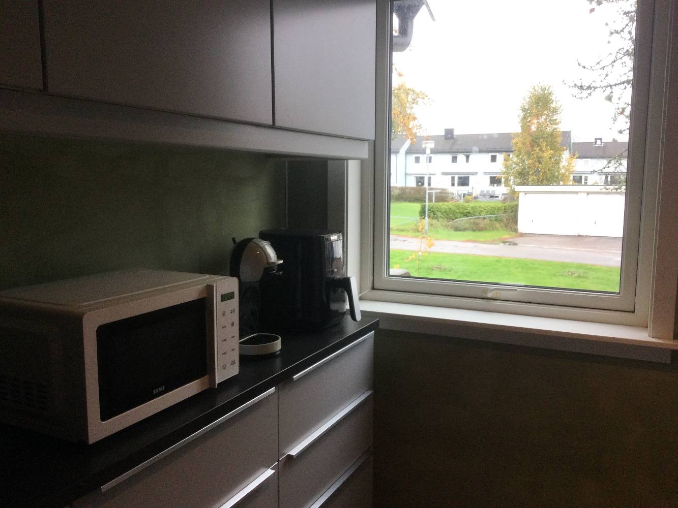 Kitchen - microwave, coffee machine and airfryer.