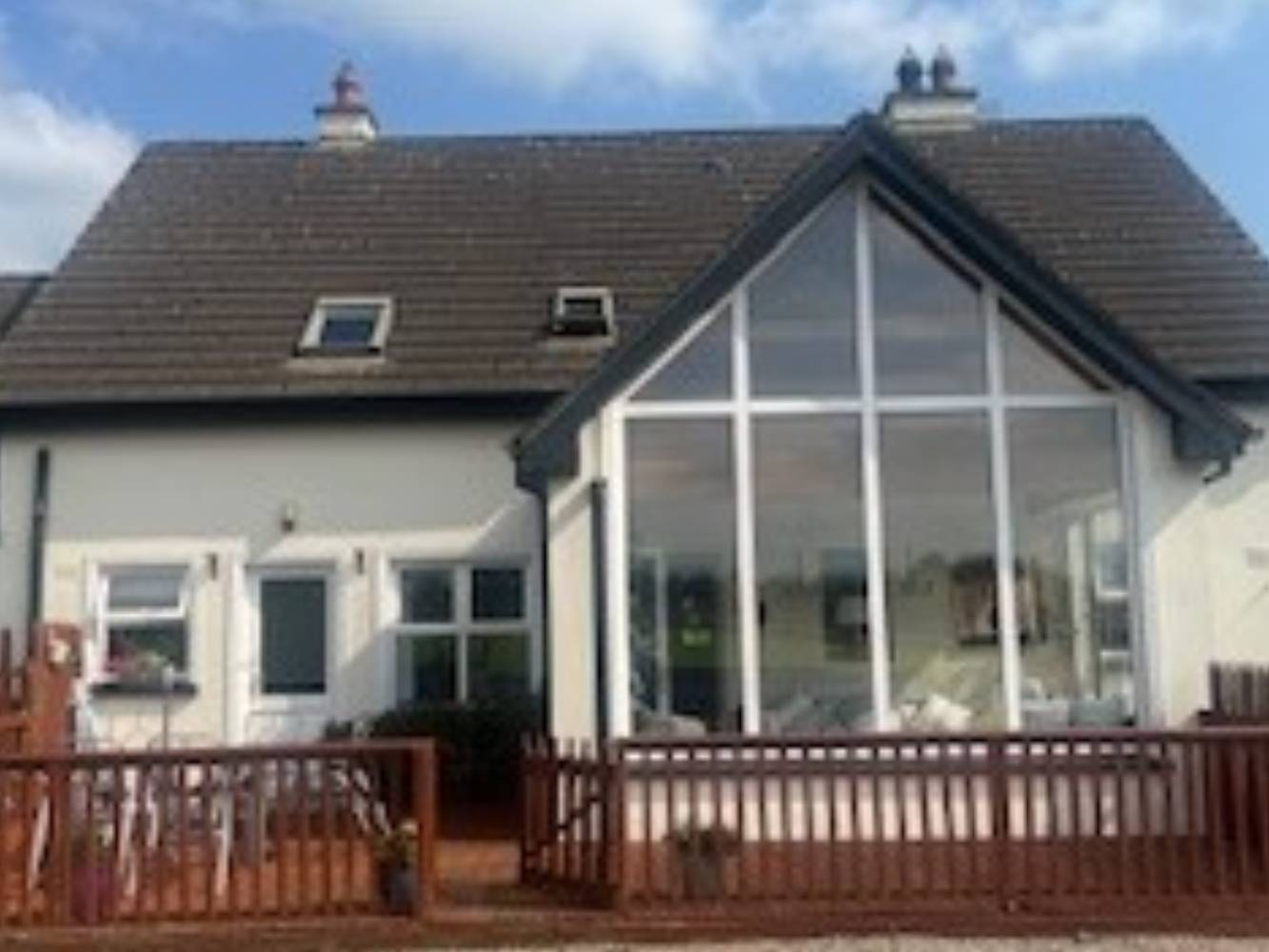 Back of house a view of sunroom